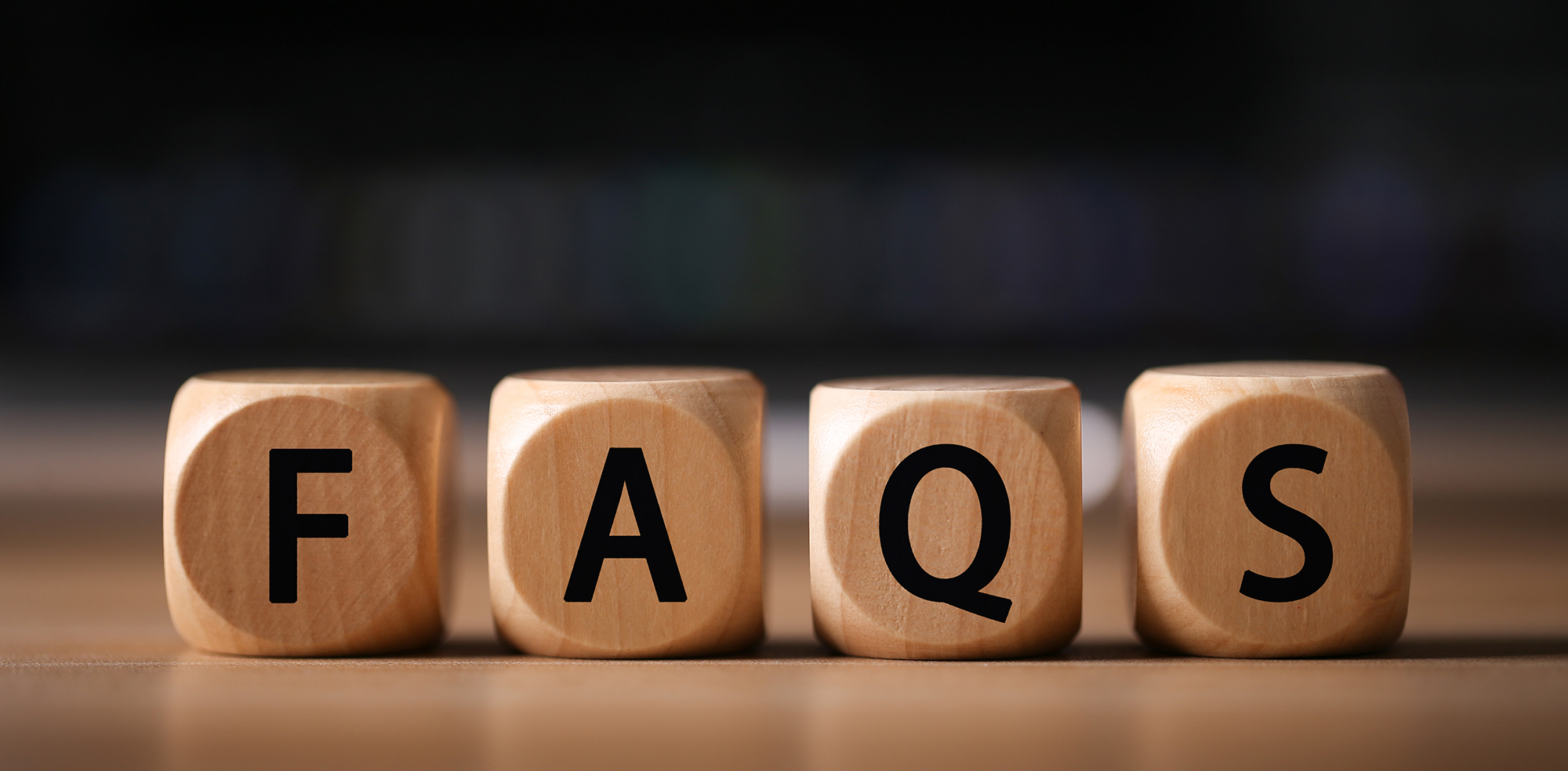 Close-up Shot of FAQS wooden blocks.